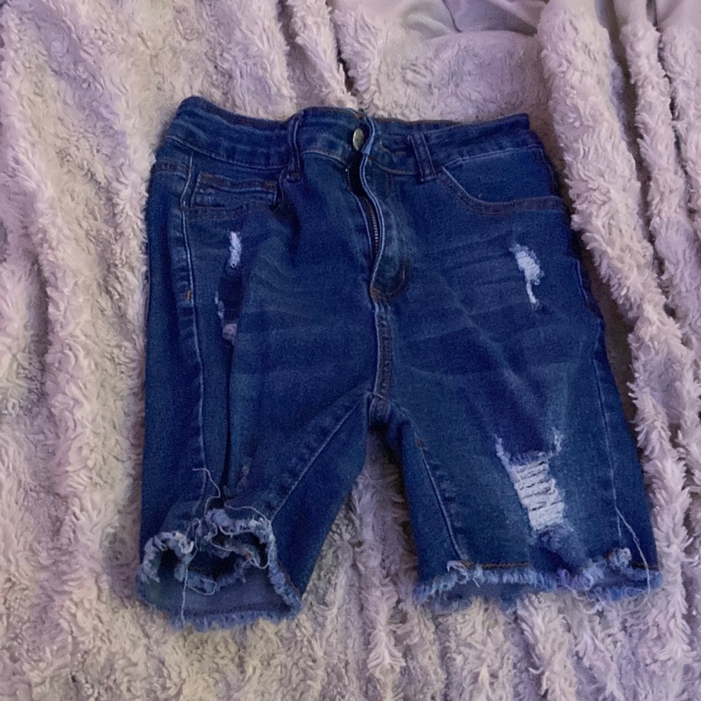 long shorts blue holes in them also